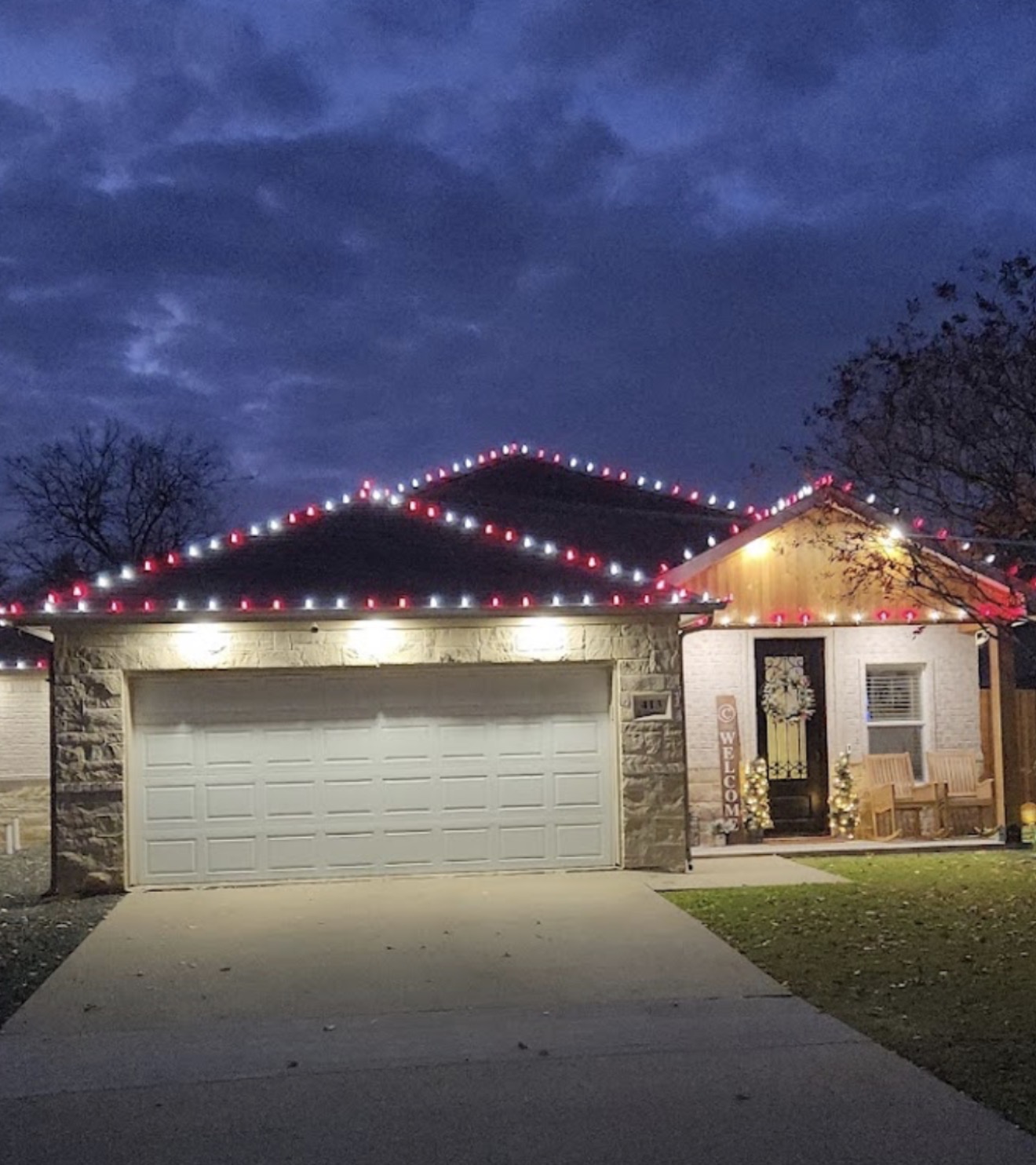 Red and white Christmas roofline light installation